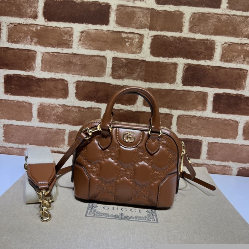 G*u*i top handle bags